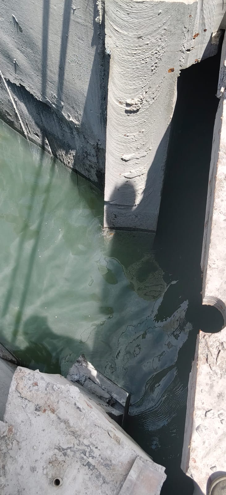 Precision concrete core and wire saw cutting inside a submerged water trench